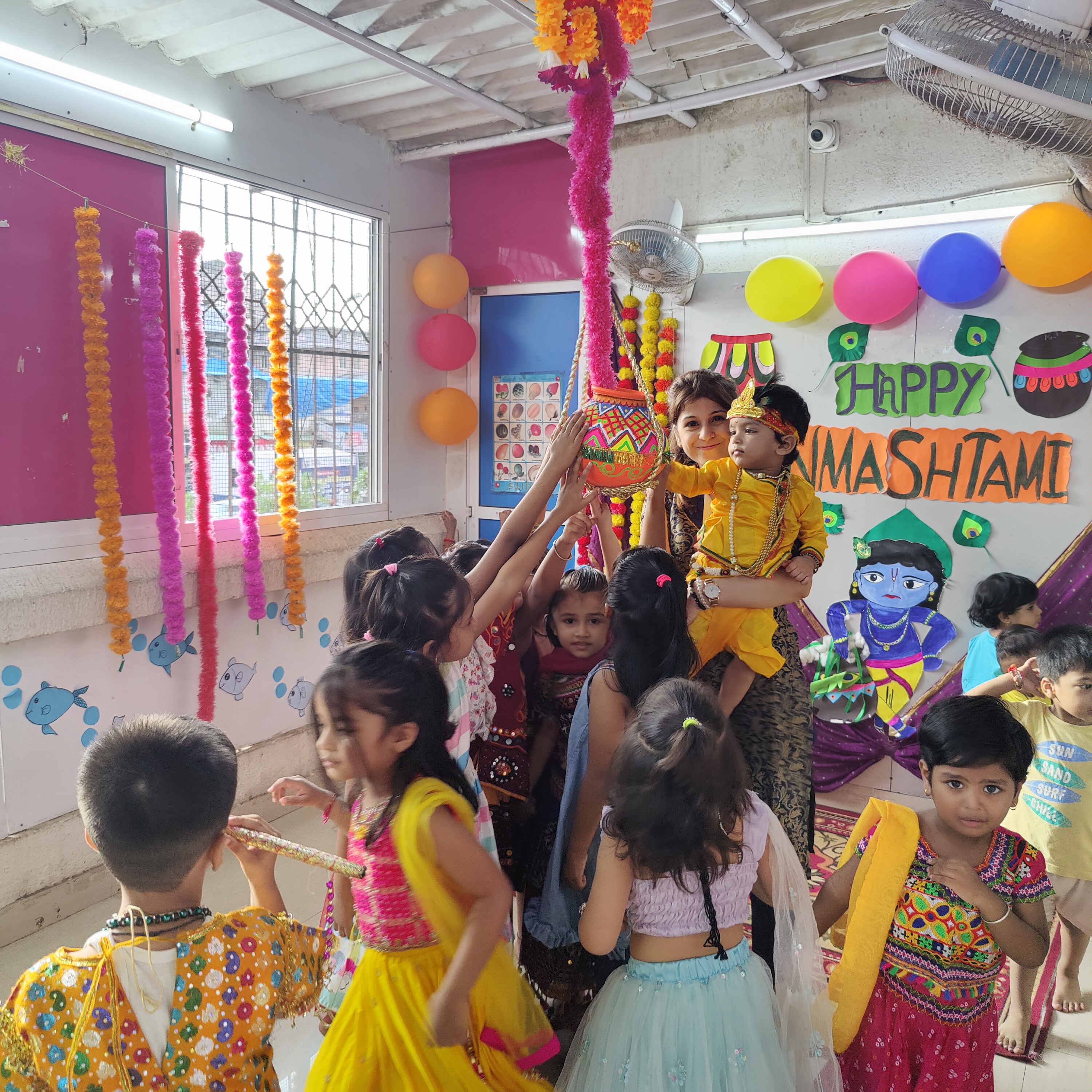 Group photo of students celebrating Janmashtami festival