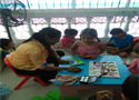 Pre-school teacher guiding kids