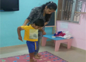 Pre-school staff guiding kids